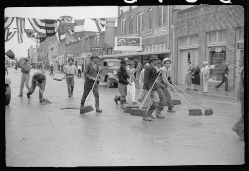 Untitled photo, possibly related to: Street cleaners follow the parade, Charro Days, Brownsville, Texas