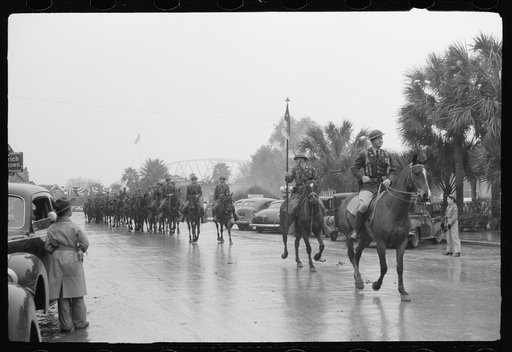 Untitled photo, possibly related to: Mexican general and American commanding officer at Brownsville, Texas review American cavalry troops in Charro Days parade