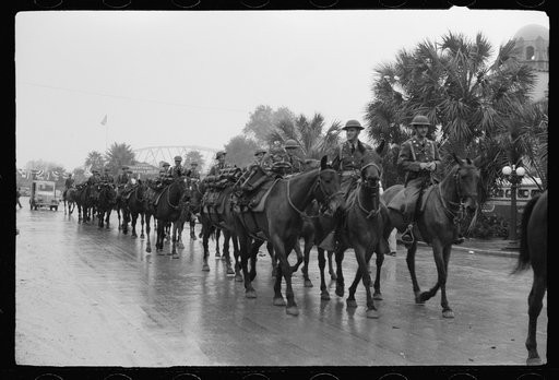 Untitled photo, possibly related to: Mexican general and American commanding officer at Brownsville, Texas review American cavalry troops in Charro Days parade
