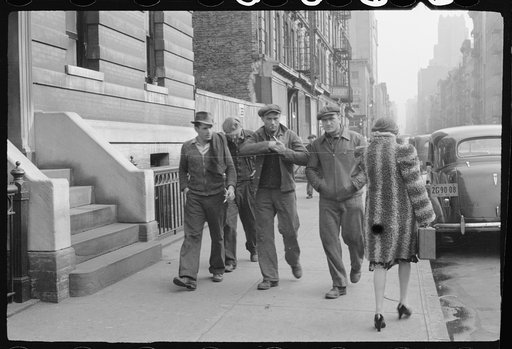 New York City, New York. Street scene, four men and one woman