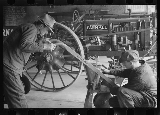 Rehabilitation client looking over farm implements, Jackson, Ohio