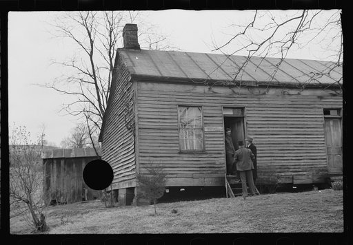 Untitled photo, possibly related to: Resettlement Administration representative at door of rehabilitation client's house, Jackson County, Ohio