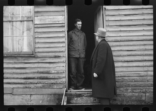 Untitled photo, possibly related to: Resettlement Administration representative at door of rehabilitation client's house, Jackson County, Ohio