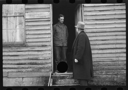 Untitled photo, possibly related to: Resettlement Administration representative at door of rehabilitation client's house, Jackson County, Ohio