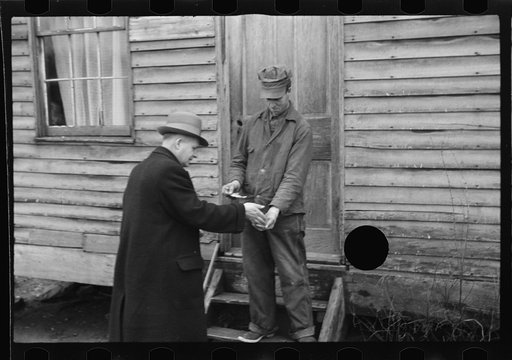 Untitled photo, possibly related to: Resettlement Administration representative at door of rehabilitation client's house, Jackson County, Ohio