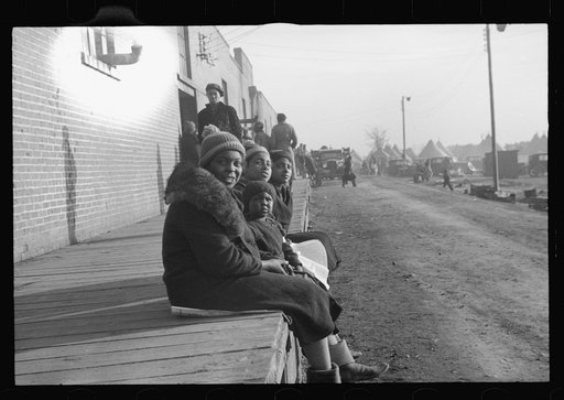 Untitled photo, possibly related to: Lined up and waiting for a meal in the camp for Negro flood refugees at Forrest City, Arkansas