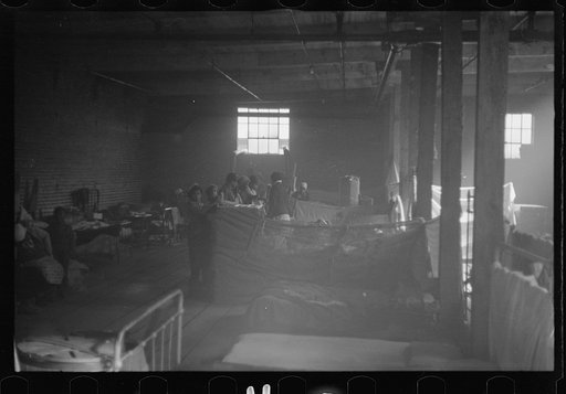 Untitled photo, possibly related to: Interior of cotton compress at Forrest City, Arkansas where sick Negro refugees from flood of 1937 are housed