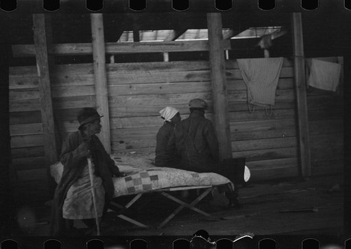 Untitled photo, possibly related to: Interior of cotton compress at Forrest City, Arkansas where sick Negro refugees from flood of 1937 are housed