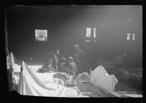 Untitled photo, possibly related to: Interior of cotton compress at Forrest City, Arkansas where sick Negro refugees from flood of 1937 are housed