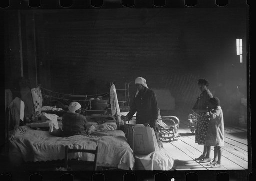 Untitled photo, possibly related to: Interior of cotton compress at Forrest City, Arkansas where sick Negro refugees from flood of 1937 are housed