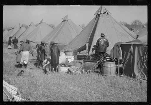 Untitled photo, possibly related to: A Negro flood refugee family who, with their rescued household goods have moved into the camp at Forrest City, Arkansas