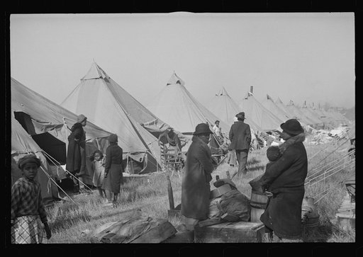Untitled photo, possibly related to: A Negro flood refugee family who, with their rescued household goods have moved into the camp at Forrest City, Arkansas