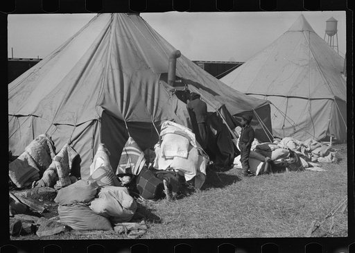 Untitled photo, possibly related to: A Negro flood refugee family who, with their rescued household goods have moved into the camp at Forrest City, Arkansas