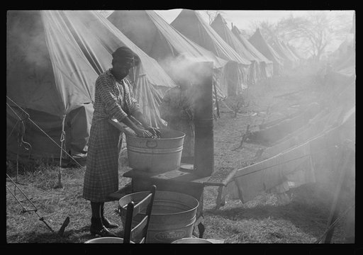 Negro flood refugee washing clothes in the camp at Forrest City, Arkansas