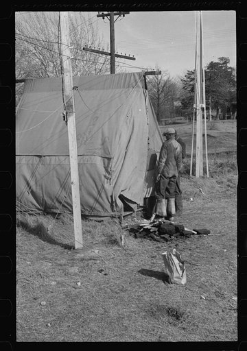 Untitled photo, possibly related to: Negro flood refugee washing clothes in the camp at Forrest City, Arkansas