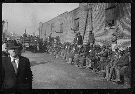 Untitled photo, possibly related to: Negro flood refugees wearing identification tags after registering in the camp at Forrest City, Arkansas