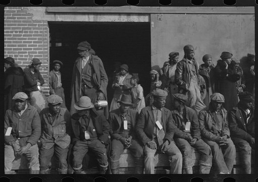 Untitled photo, possibly related to: Negro flood refugees wearing identification tags after registering in the camp at Forrest City, Arkansas