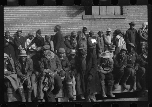 Untitled photo, possibly related to: Negro flood refugees wearing identification tags after registering in the camp at Forrest City, Arkansas