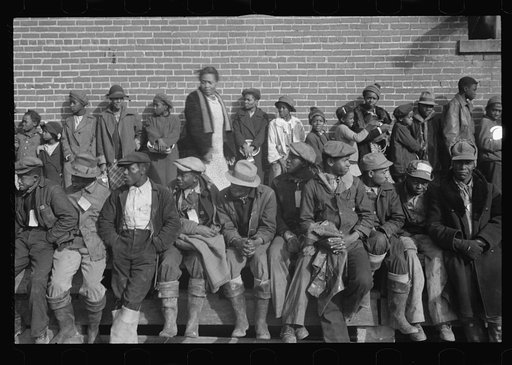 Untitled photo, possibly related to: Negro flood refugees wearing identification tags after registering in the camp at Forrest City, Arkansas