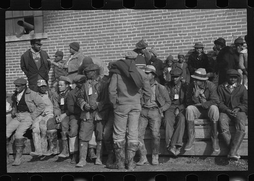 Untitled photo, possibly related to: Negro flood refugees wearing identification tags after registering in the camp at Forrest City, Arkansas