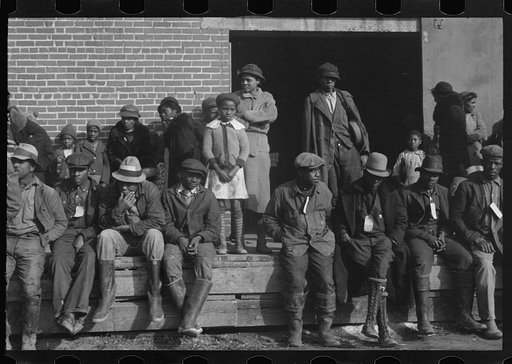 Untitled photo, possibly related to: Negro flood refugees wearing identification tags after registration in the concentration camp at Forrest City, Arkansas
