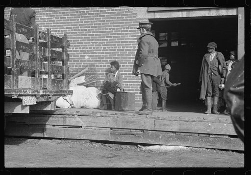 Untitled photo, possibly related to: Awaiting registration in the camp for Negro flood refugees at Forrest City, Arkansas