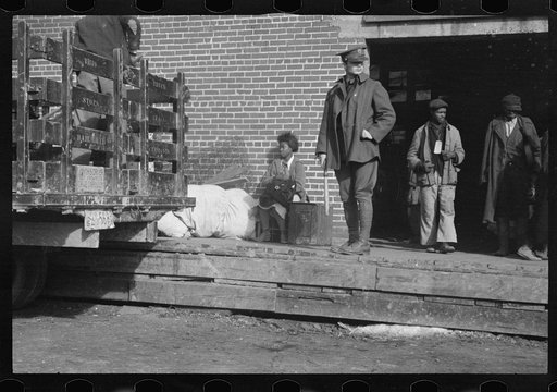Untitled photo, possibly related to: Awaiting registration in the camp for Negro flood refugees at Forrest City, Arkansas