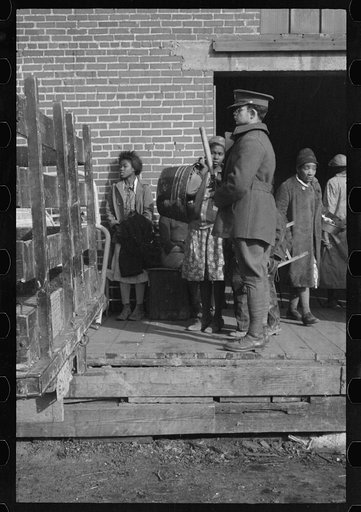 Untitled photo, possibly related to: Awaiting registration in the camp for Negro flood refugees at Forrest City, Arkansas