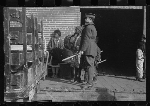Untitled photo, possibly related to: Awaiting registration in the camp for Negro flood refugees at Forrest City, Arkansas