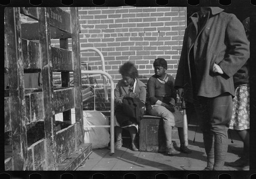 Untitled photo, possibly related to: Awaiting registration in the camp for Negro flood refugees at Forrest City, Arkansas
