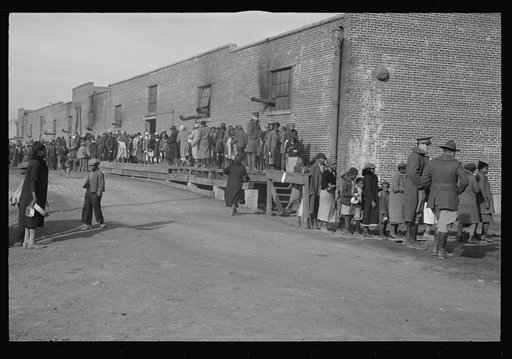 Untitled photo, possibly related to: Negro flood refugees wearing identification tags after registration in the concentration camp at Forrest City, Arkansas
