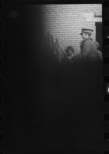 Untitled photo, possibly related to: Negro flood refugees wearing identification tags after registration in the concentration camp at Forrest City, Arkansas