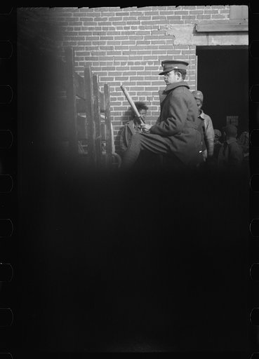 Untitled photo, possibly related to: Negro flood refugees wearing identification tags after registration in the concentration camp at Forrest City, Arkansas