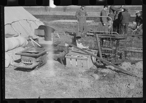 Untitled photo, possibly related to: A family of flood refugees and their salvaged household goods in the camp at Forrest City