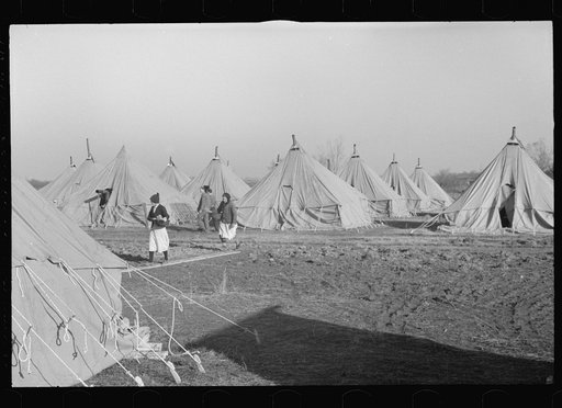 Untitled photo, possibly related to: Man at work in the camp for white flood refugees, Forrest City, Arkansas