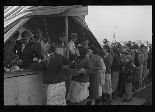 Untitled photo, possibly related to: Line of flood refugees at mealtime in camp for white flood refugees at Forrest City, Arkansas