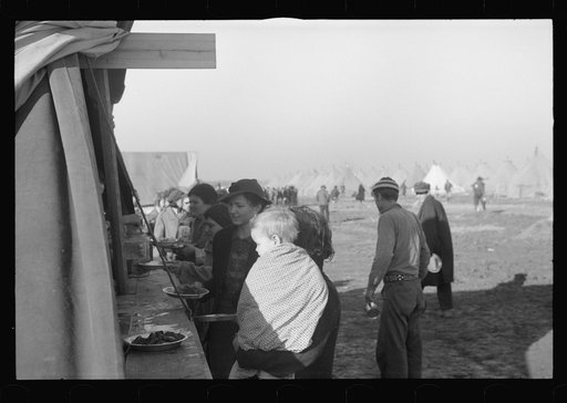 Untitled photo, possibly related to: Part of the mess line at mealtime in camp for white flood refugees at Forrest City, Arkansas