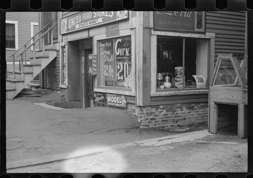 Untitled photo, possibly related to: Woman sitting on step, Manchester, New Hampshire