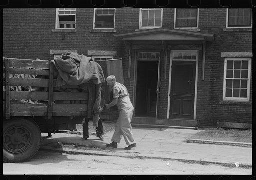 Loading a bureau into truck, Manchester, New Hampshire