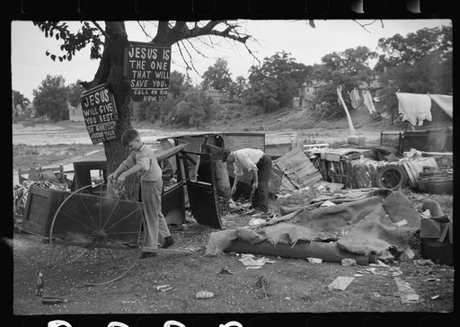 Buddy Sheppard and his father, part-time agricultural workers in Bridgeton, New Jersey, raking junk pile for old metal and bottles to sell. During the off-seasons these people must find all manner of strange occupations to round out an inadequate relief diet
