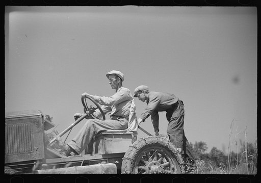 Luke Weldon, small farmer, and his son using ancient Buick (transformed by cutting down the chassis) as improvised tractor. Automobile bought in second hand car lot. Cost fifteen dollars. New Bridgeton, New Jersey