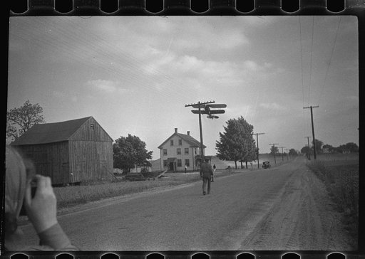 Untitled photo, possibly related to: Dusting plane hedge-hopping after spraying swath on beanfield. These planes can spray 100 acres an hour, can usually fly one or two hours unless it rains or storms in an average day. The ususal traveling "dusting circus" has at least three or four planes, its own
