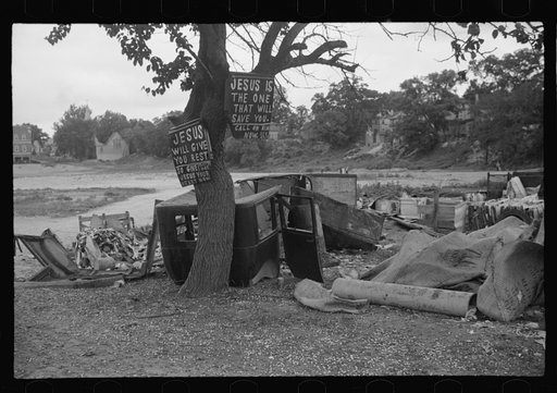 Untitled photo, possibly related to: Buddy Sheppard and his father, part-time agricultural workers in Bridgetown, New Jersey, raking junk pile for old metal and bottles to sell. During the off-seasons these people must find all manner of strange occupations to round out an inadequate relief diet