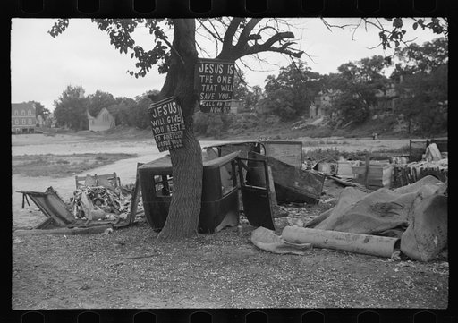 Untitled photo, possibly related to: Buddy Sheppard and his father, part-time agricultural workers in Bridgetown, New Jersey, raking junk pile for old metal and bottles to sell. During the off-seasons these people must find all manner of strange occupations to round out an inadequate relief diet