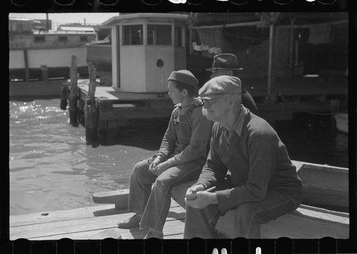 Untitled photo, possibly related to: Summer residents watch the tourist boat arrive from Boston, Provincetown, Massachusetts