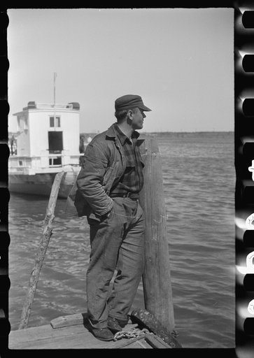 Untitled photo, possibly related to: Summer residents watch the tourist boat arrive from Boston, Provincetown, Massachusetts