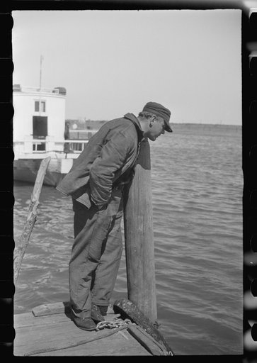 Untitled photo, possibly related to: Summer residents watch the tourist boat arrive from Boston, Provincetown, Massachusetts