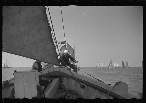 Untitled photo, possibly related to: Summer residents watch the tourist boat arrive from Boston, Provincetown, Massachusetts