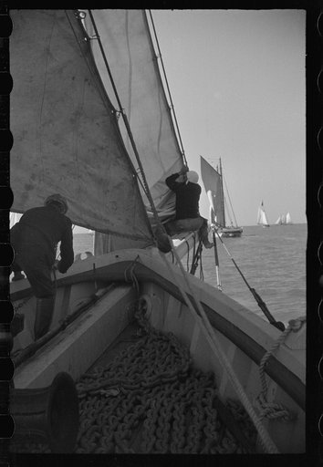 Untitled photo, possibly related to: Summer residents watch the tourist boat arrive from Boston, Provincetown, Massachusetts