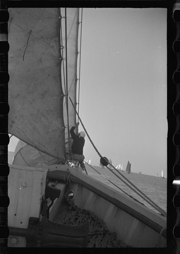 Untitled photo, possibly related to: Summer residents watch the tourist boat arrive from Boston, Provincetown, Massachusetts